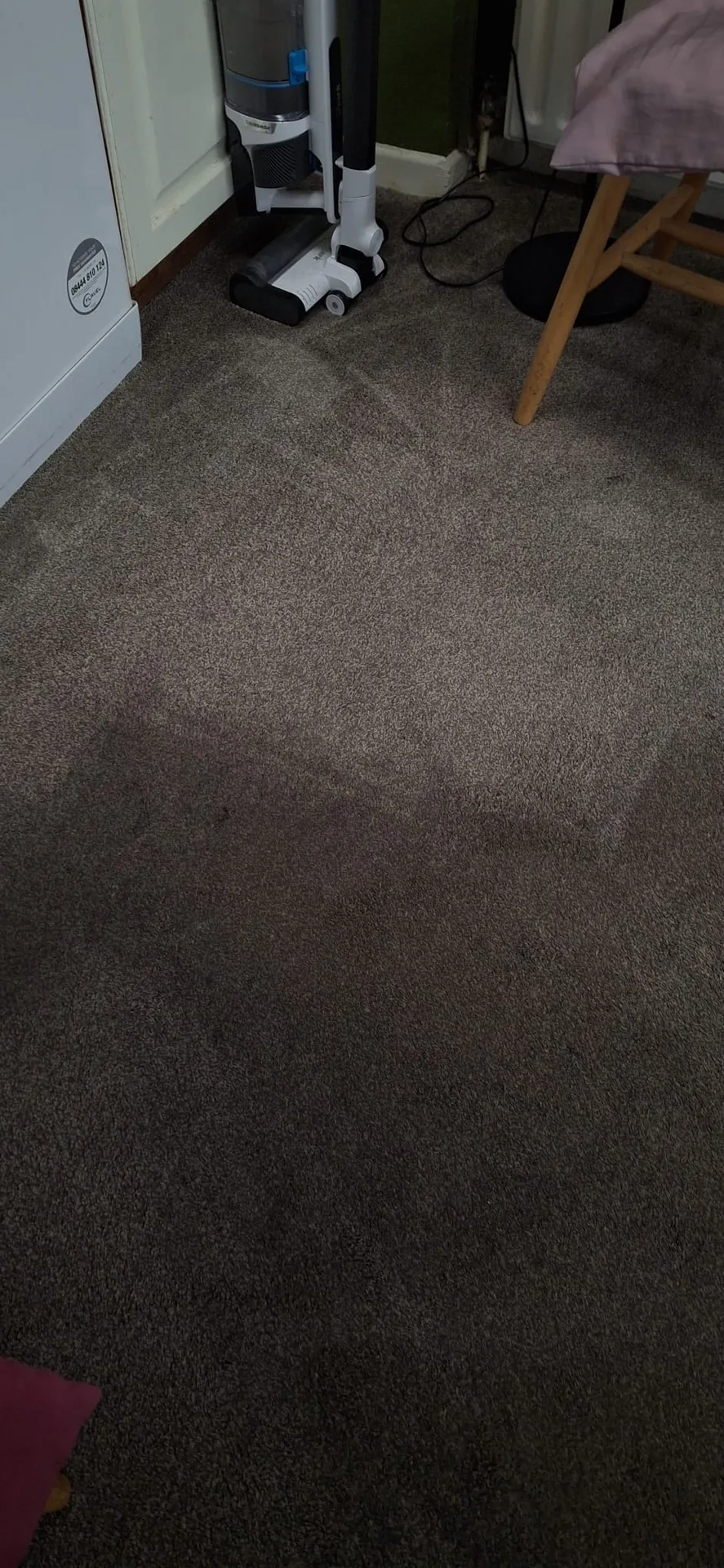 Professionally cleaned dark residential carpet