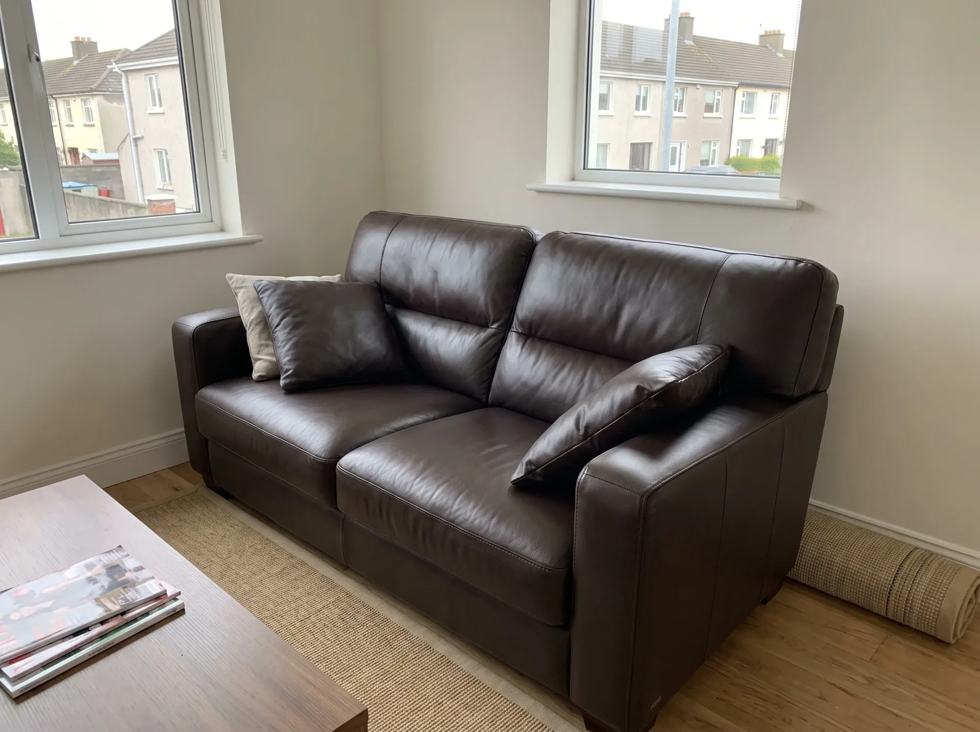Clean black leather sofa after professional leather upholstery cleaning