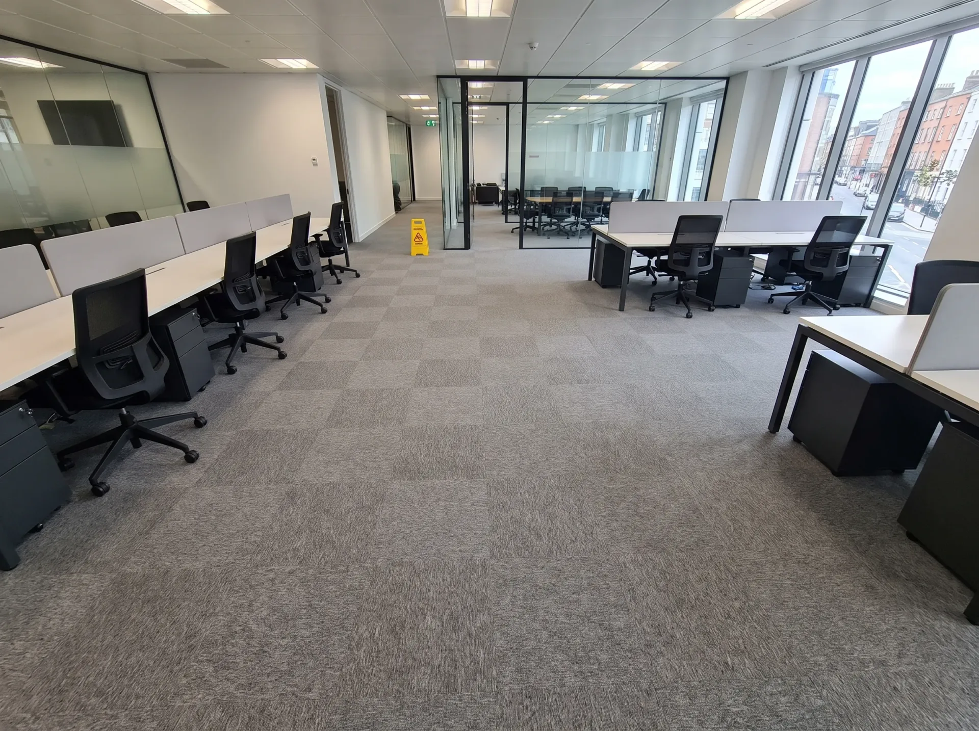 Office Carpet Cleaning - gray patterned commercial carpet in modern office workspace